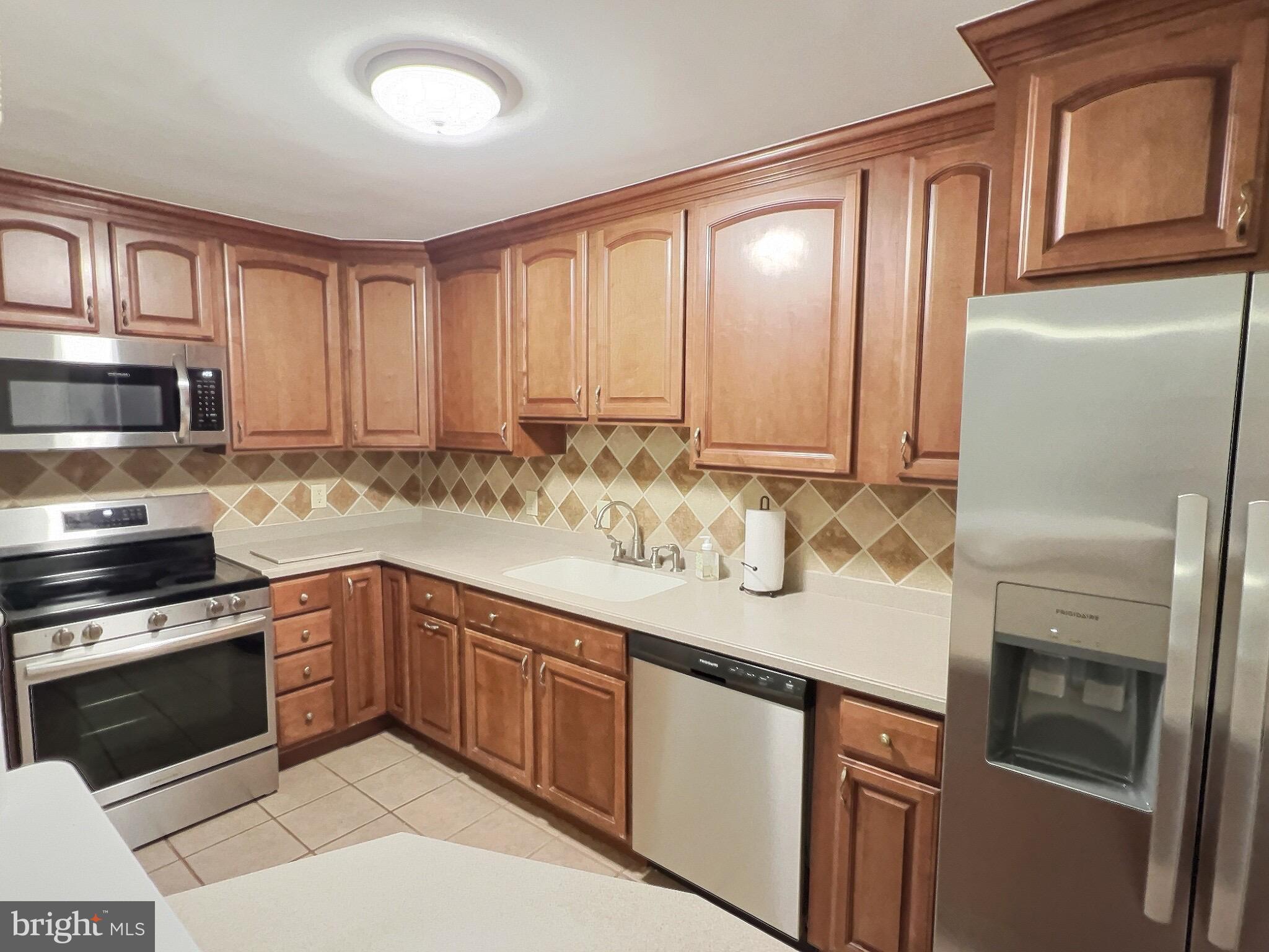 1944 Church Road Baltimore, MD 21222 - Photo 2 of 14 a kitchen with granite countertop stainless steel appliances and cabinets