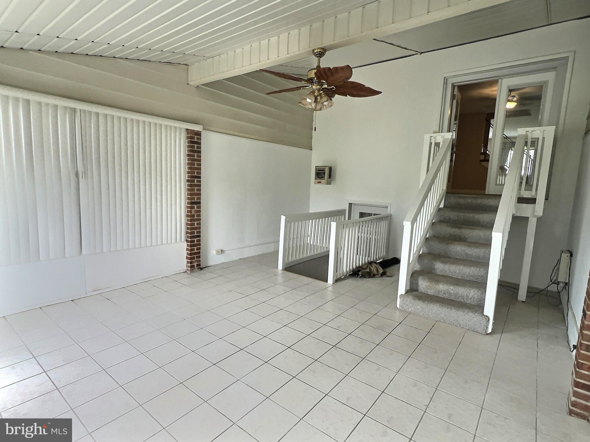 1944 Church Road Baltimore, MD 21222 - Photo 6 of 14 an empty room with a ceiling fan