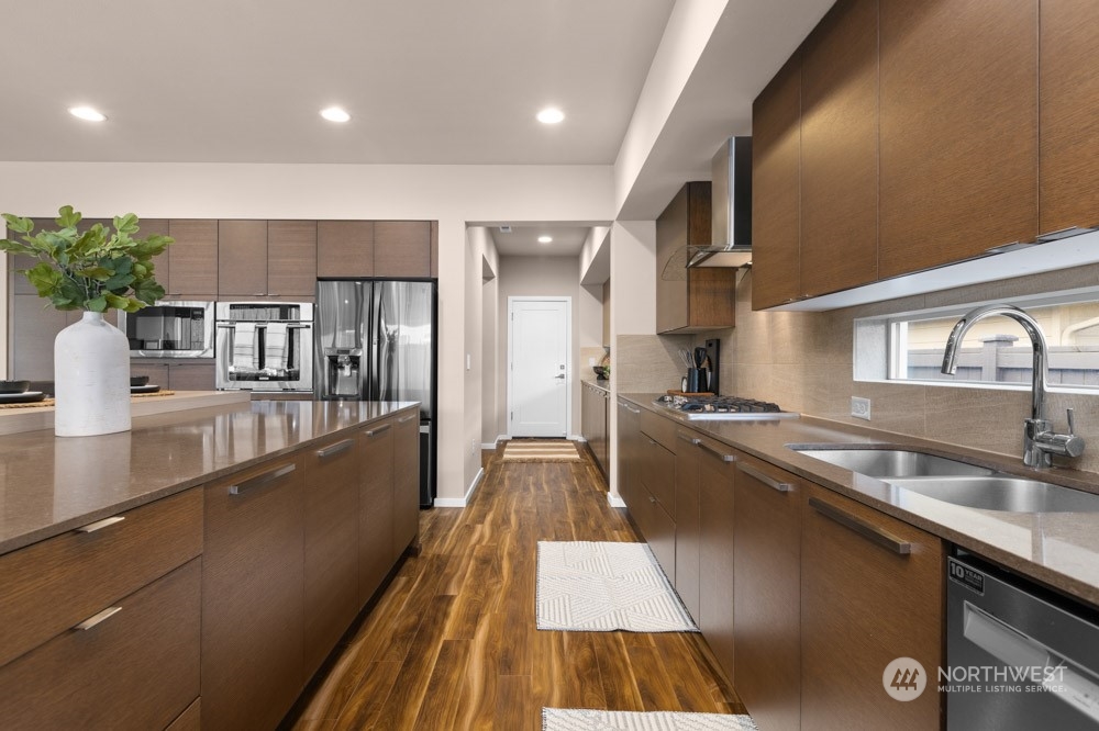 4021 168th Place Southeast Bothell, WA 98012 - Photo 12 of 39 a kitchen with stainless steel appliances granite countertop a sink and stove
