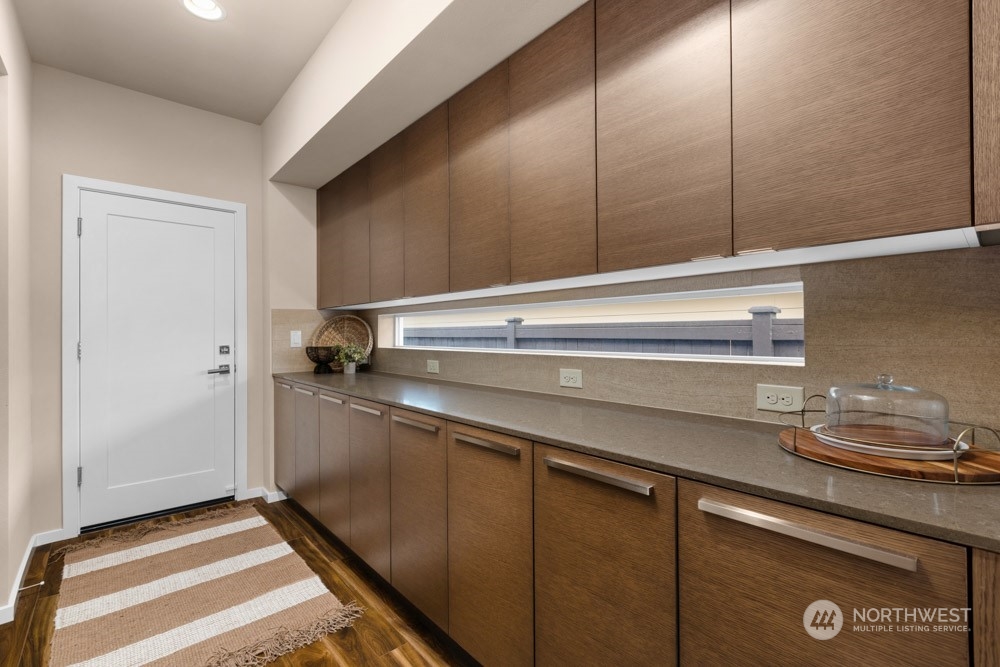4021 168th Place Southeast Bothell, WA 98012 - Photo 13 of 39 a kitchen with a sink and cabinets