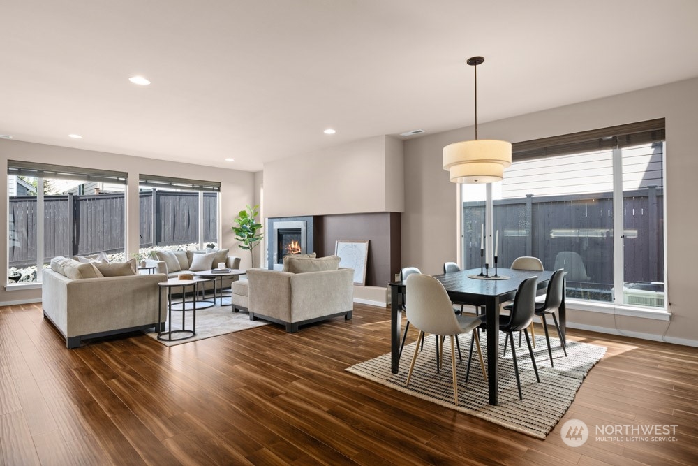 4021 168th Place Southeast Bothell, WA 98012 - Photo 15 of 39 a living room with fireplace furniture and a wooden floor