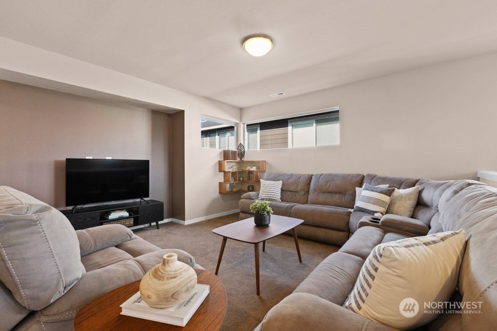 4021 168th Place Southeast Bothell, WA 98012 - Photo 18 of 39 a living room with furniture and a flat screen tv