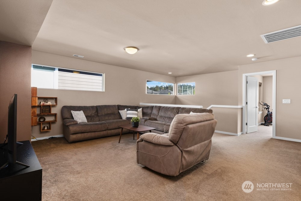 4021 168th Place Southeast Bothell, WA 98012 - Photo 19 of 39 a living room with furniture and a flat screen tv