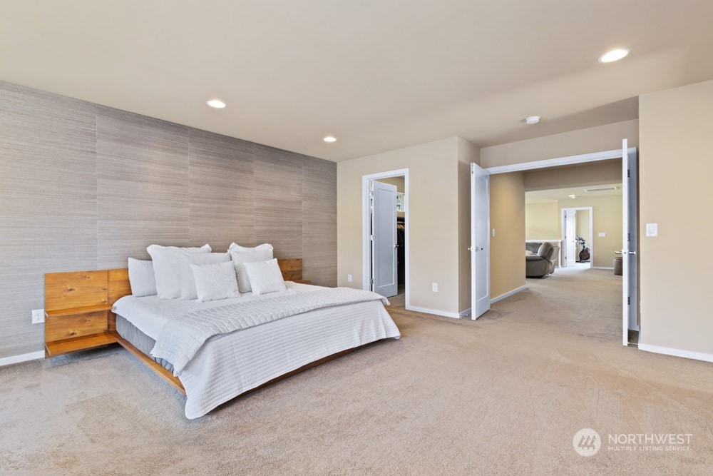 4021 168th Place Southeast Bothell, WA 98012 - Photo 20 of 39 a spacious bedroom with a bed and a lamp