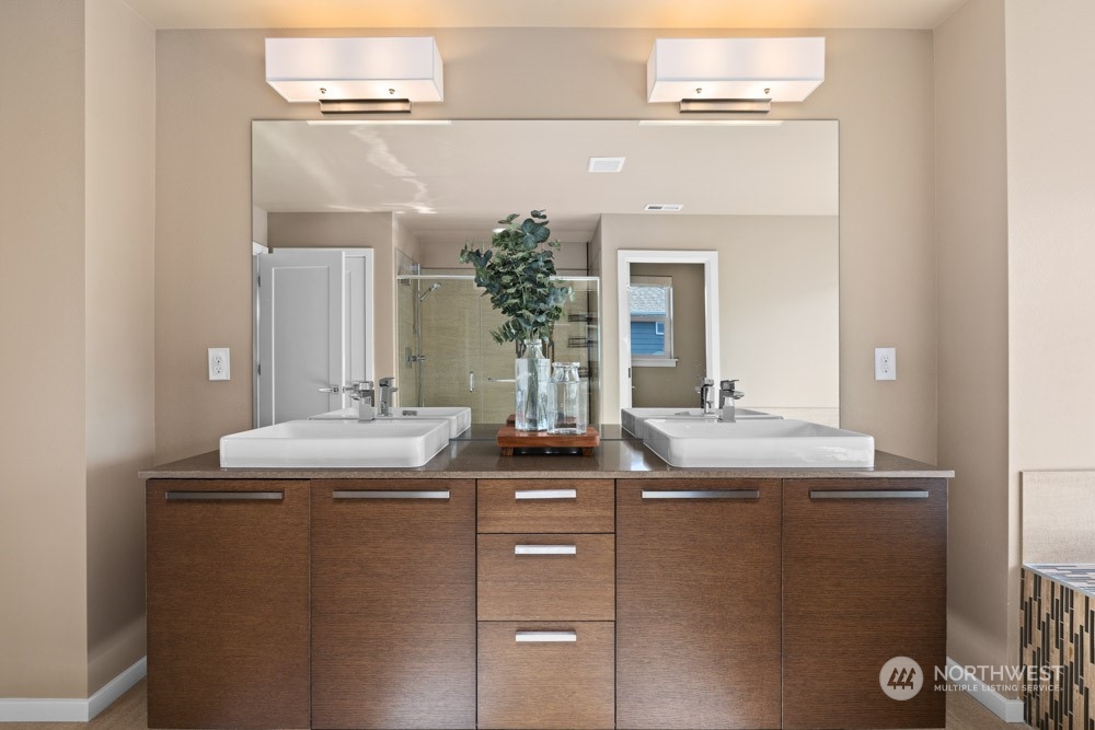 4021 168th Place Southeast Bothell, WA 98012 - Photo 23 of 39 a bathroom with a granite countertop sink and a mirror