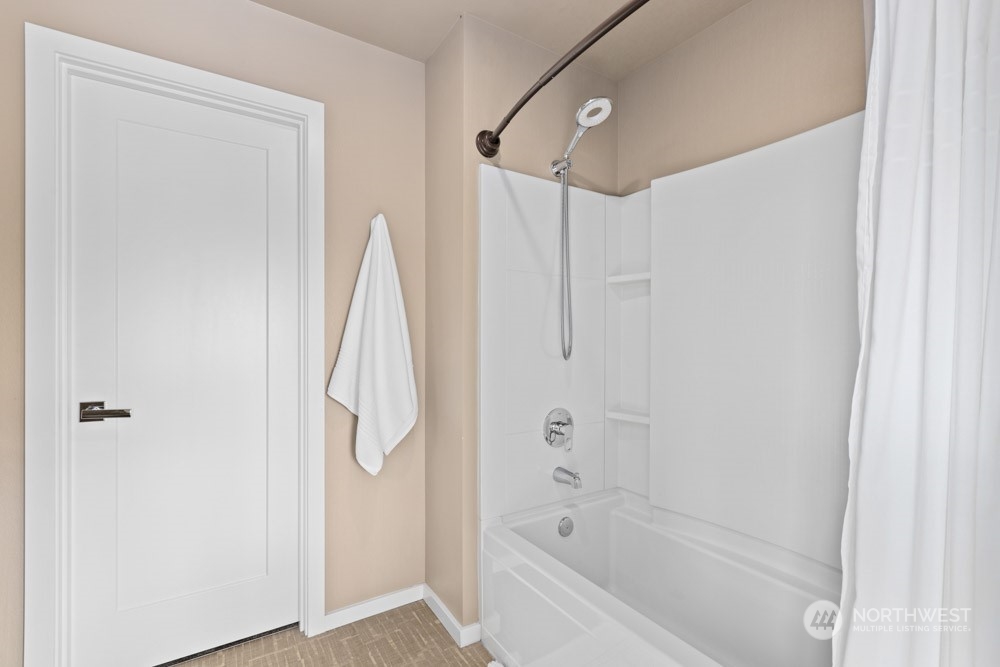 4021 168th Place Southeast Bothell, WA 98012 - Photo 27 of 39 a bathroom with a shower and a tub