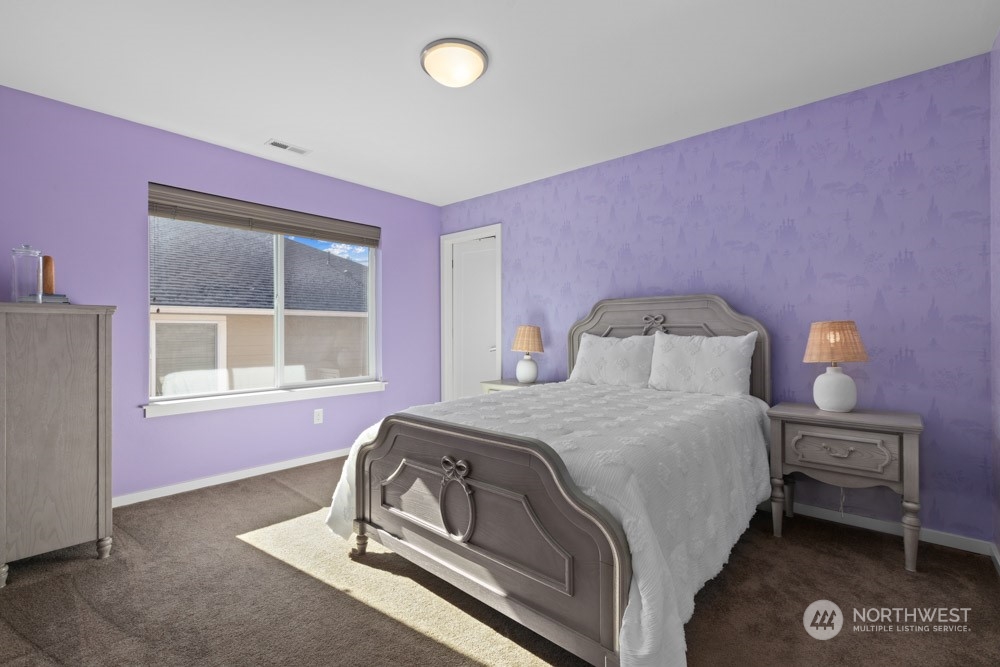 4021 168th Place Southeast Bothell, WA 98012 - Photo 28 of 39 a bedroom with a bed and a window
