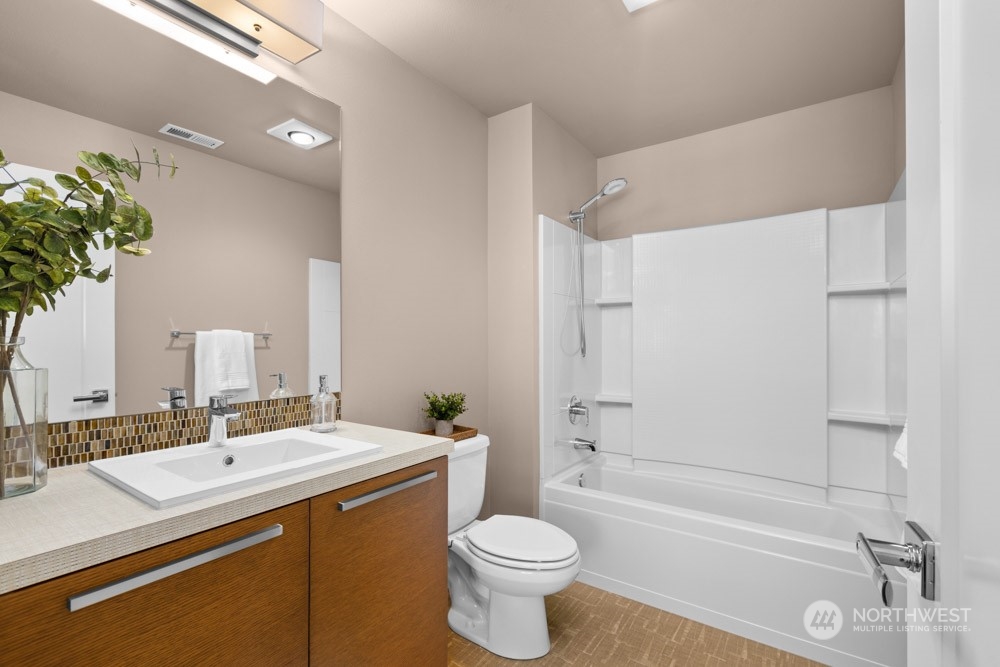 4021 168th Place Southeast Bothell, WA 98012 - Photo 31 of 39 a bathroom with a sink a toilet and shower