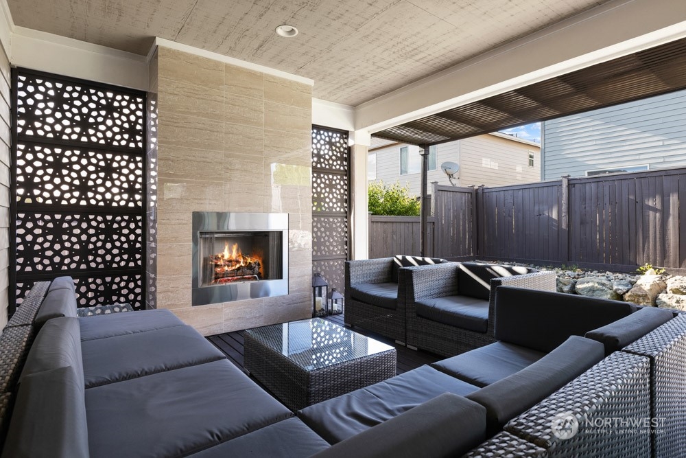 4021 168th Place Southeast Bothell, WA 98012 - Photo 33 of 39 a living room with furniture and a fireplace
