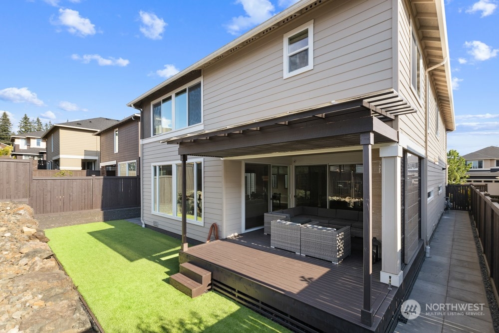 4021 168th Place Southeast Bothell, WA 98012 - Photo 35 of 39 a view of a house with backyard porch and sitting area