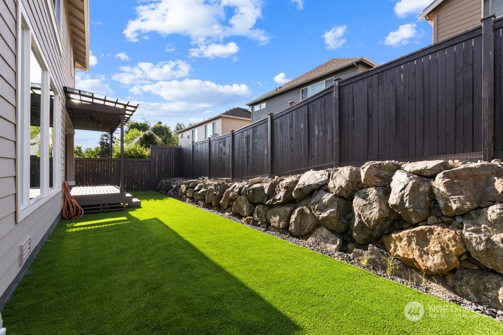 4021 168th Place Southeast Bothell, WA 98012 - Photo 37 of 39 a view of a backyard with wooden fence