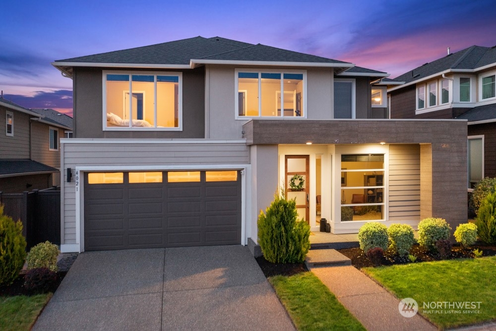 4021 168th Place Southeast Bothell, WA 98012 - Photo 38 of 39 a front view of a house with a yard and garage