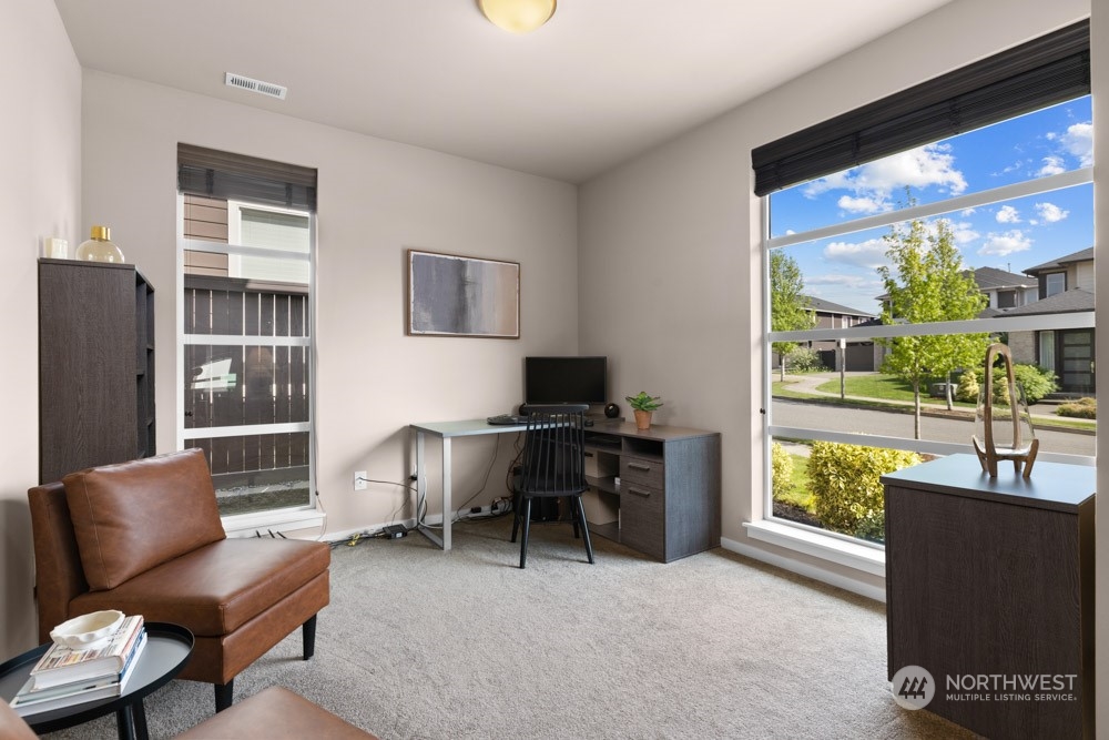 4021 168th Place Southeast Bothell, WA 98012 - Photo 4 of 39 a work room with furniture and a window