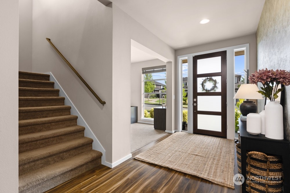 4021 168th Place Southeast Bothell, WA 98012 - Photo 5 of 39 a view of an entryway with wooden floor and windows