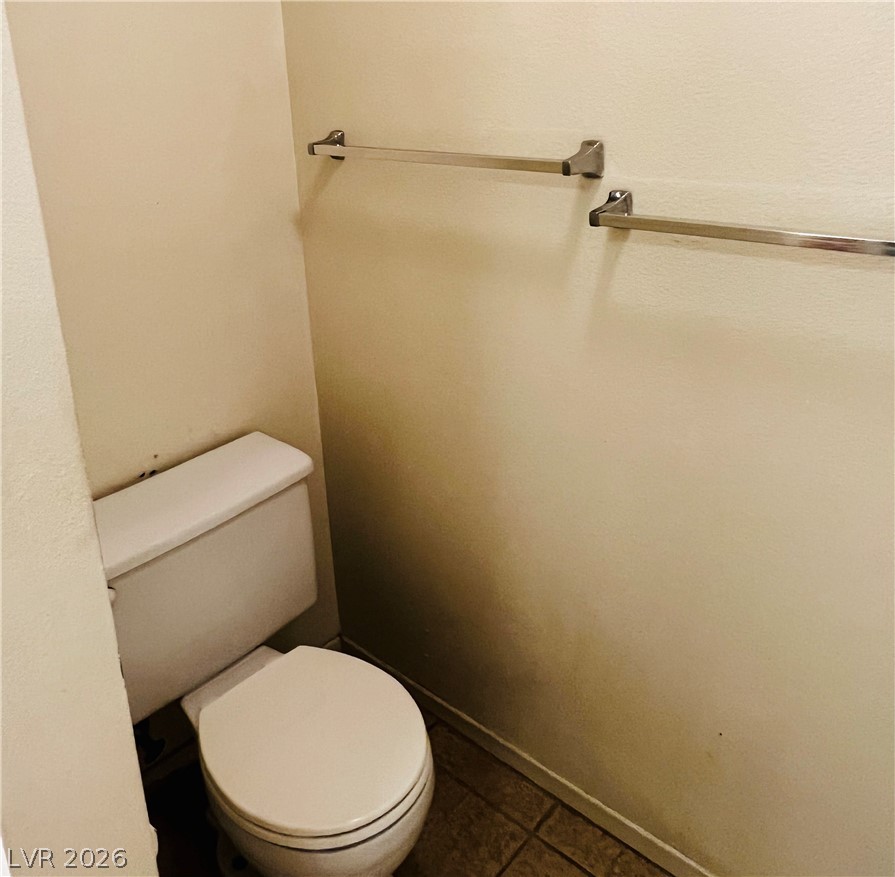 709 Ridgemount Drive Las Vegas, NV 89107 - Photo 24 of 40 Primary bath has toilet and shower separate from sink and makeup area