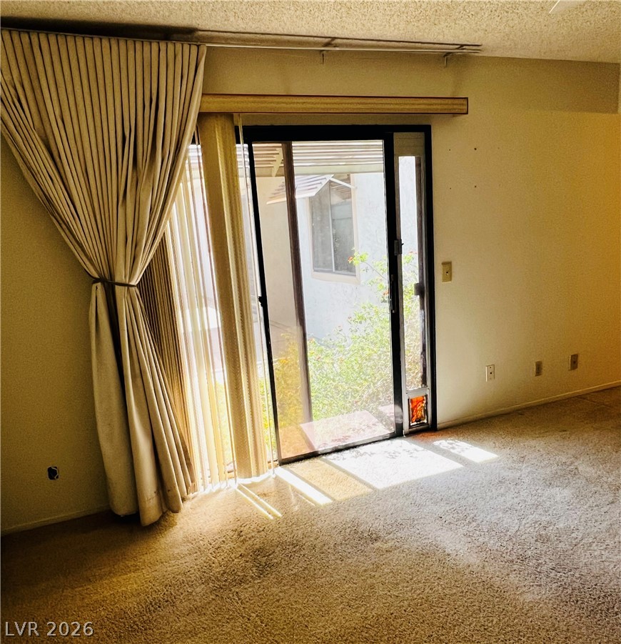 709 Ridgemount Drive Las Vegas, NV 89107 - Photo 28 of 40 Primary bedroom has patio door to patio/courtyard area. Pet door can be used or easily removed.