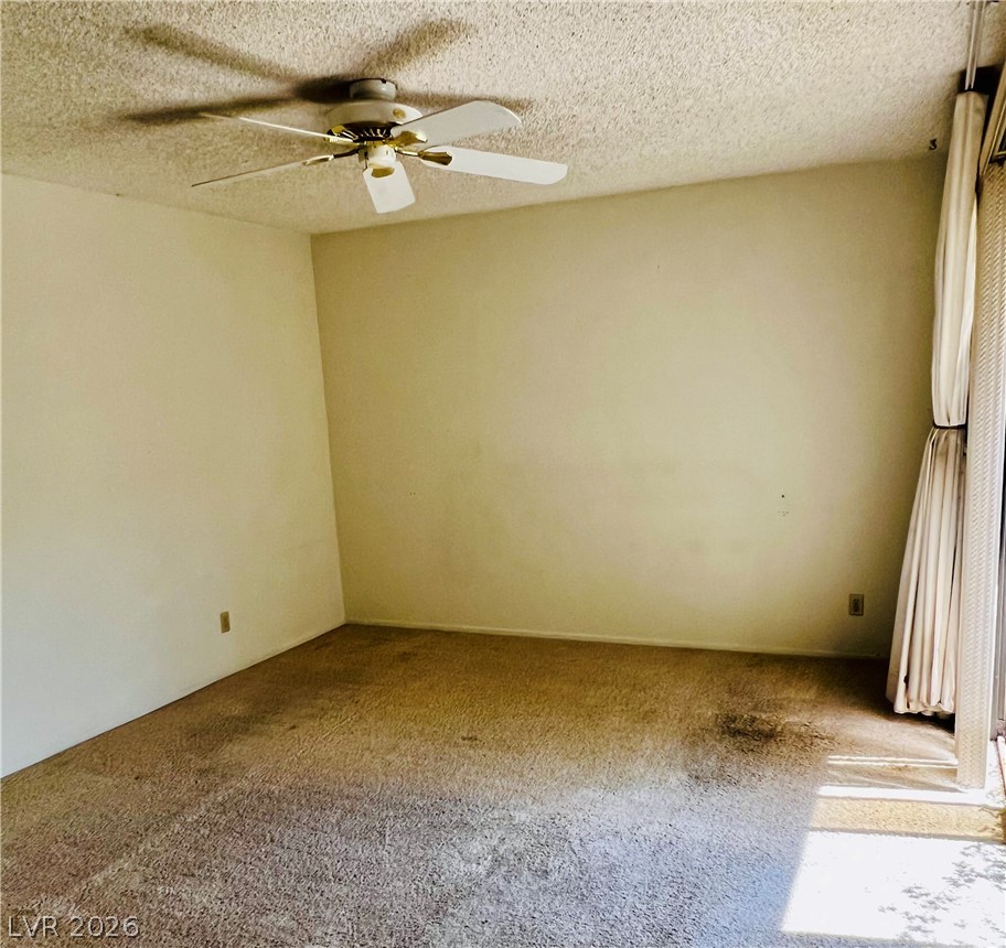 709 Ridgemount Drive Las Vegas, NV 89107 - Photo 30 of 40 Primary bedroom has vaulted ceiling, mirrowed closet doors and secondary closet in bathroom.