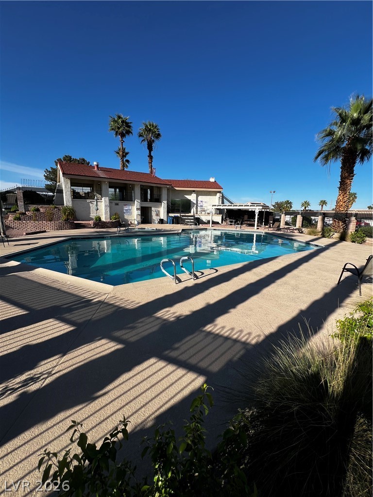 709 Ridgemount Drive Las Vegas, NV 89107 - Photo 39 of 40 Community pool featuring a patio