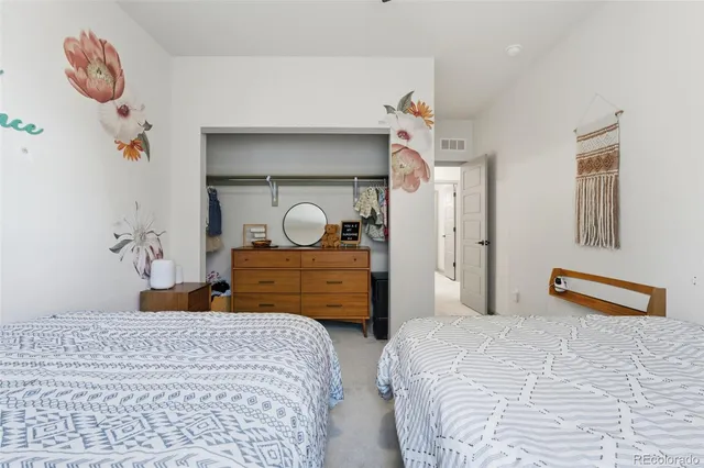 a bedroom with bed and window