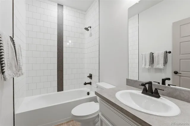 a bathroom with a toilet a sink and a bathtub