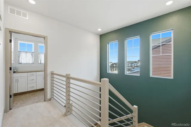 a utility room with cabinets washer and dryer