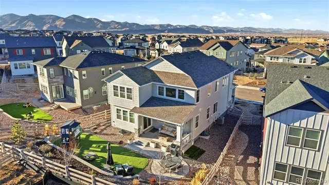 a view of a house with sitting area and garden