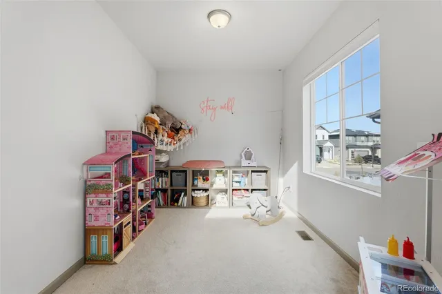 a room with furniture a washer and dryer