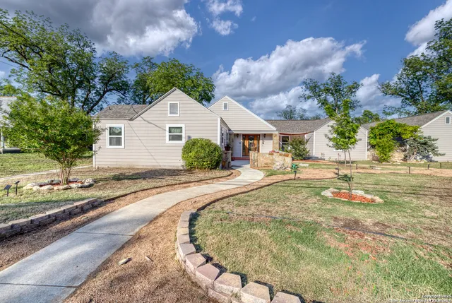a house with yard in front of it