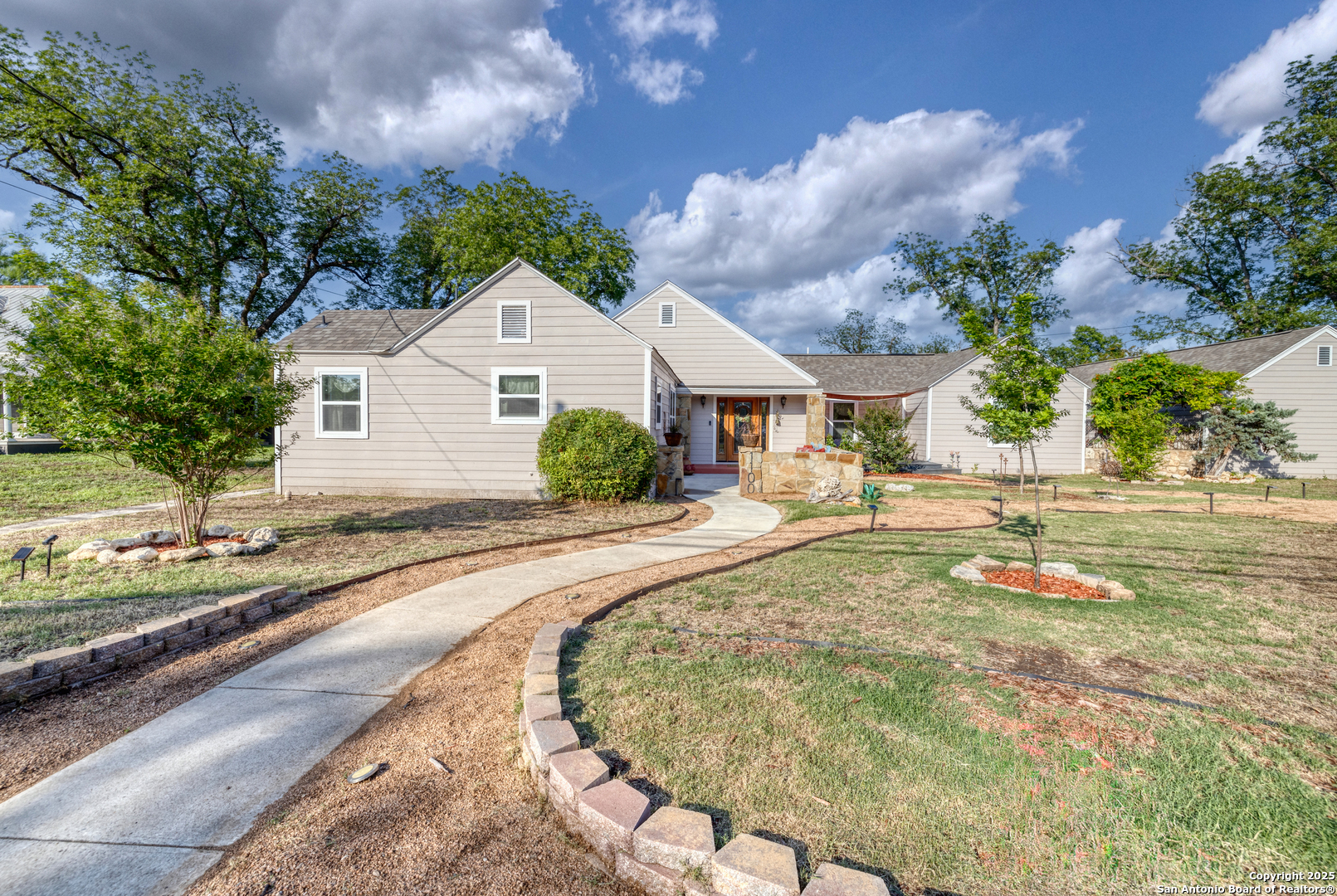 a house with yard in front of it