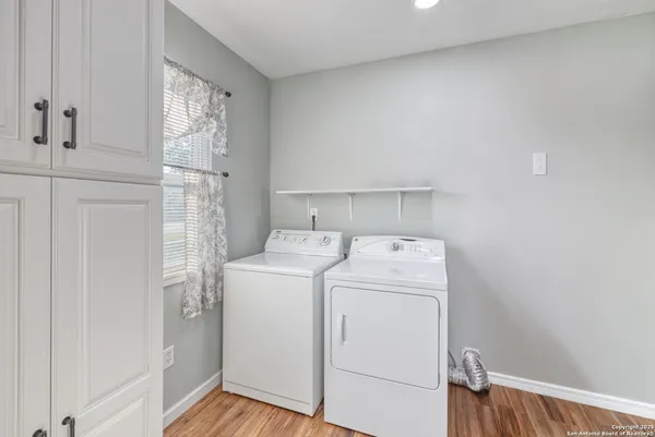 a view of storage and utility room with washer and dryer