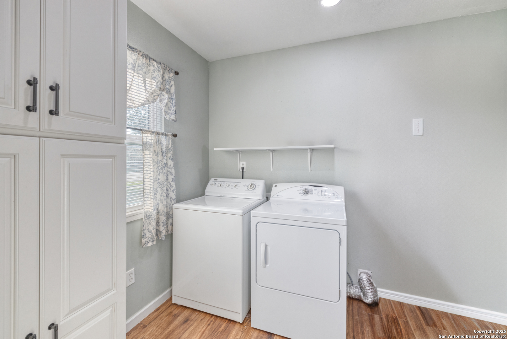 1100 North High Street Uvalde, TX 78801 - Photo 12 of 40 a view of storage and utility room with washer and dryer