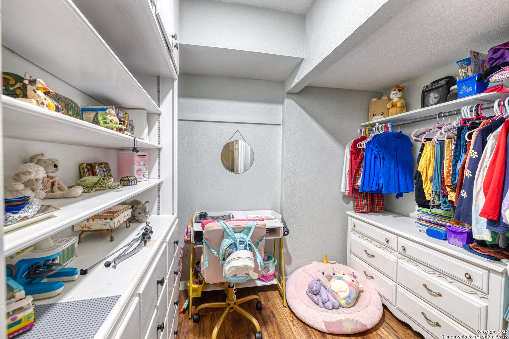 1100 North High Street Uvalde, TX 78801 - Photo 15 of 40 a room with furniture and wooden floor