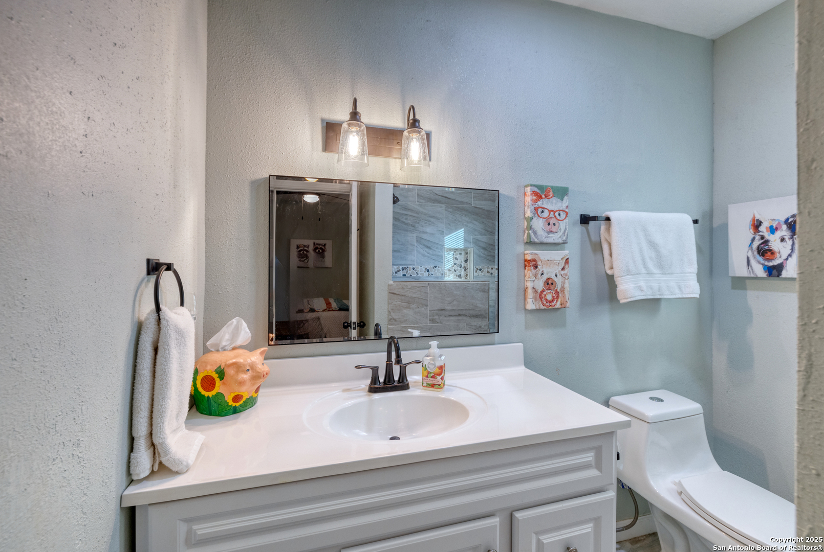 1100 North High Street Uvalde, TX 78801 - Photo 16 of 40 a bathroom with a sink and a mirror