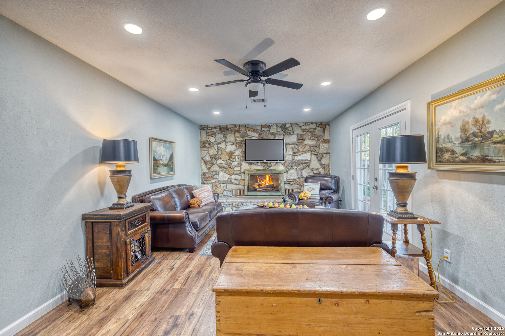 1100 North High Street Uvalde, TX 78801 - Photo 17 of 40 a bed room with furniture and a flat screen tv