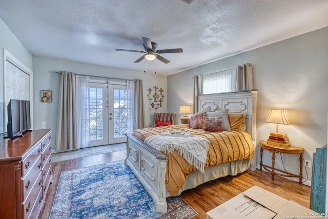 a bedroom with furniture window and wooden floor
