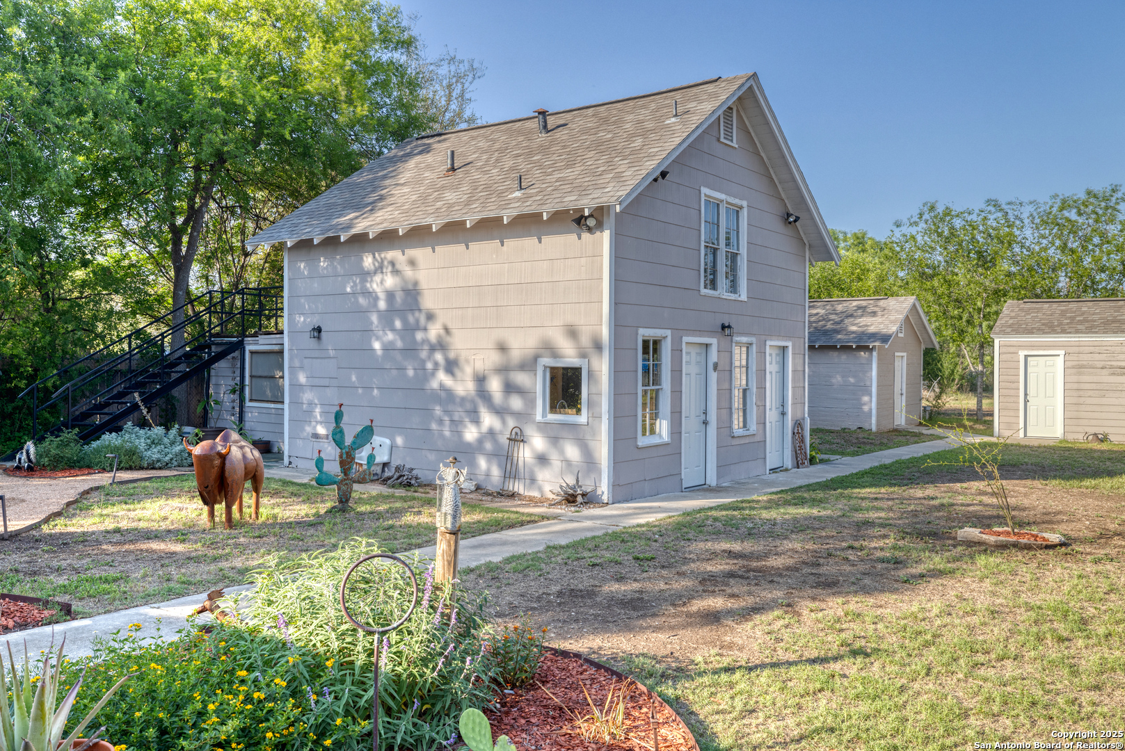 1100 North High Street Uvalde, TX 78801 - Photo 27 of 40 a view of a house with backyard and a tree