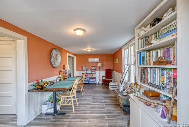 a picture of a hallway with furniture