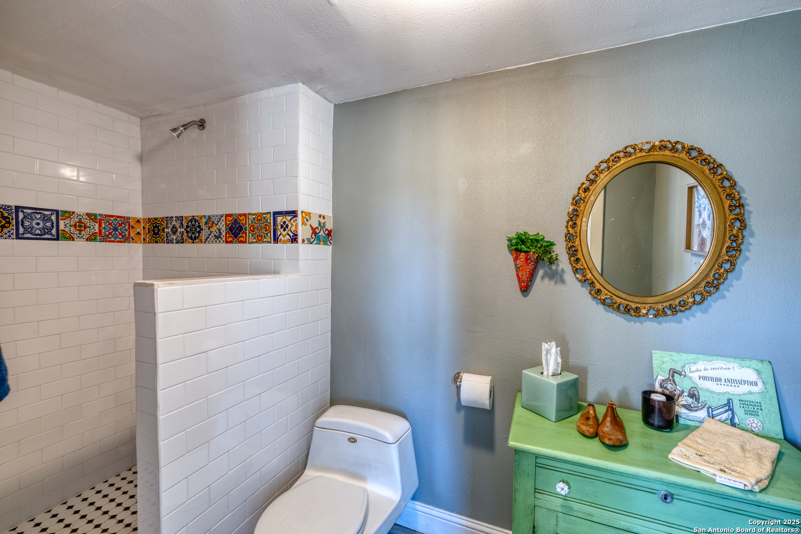1100 North High Street Uvalde, TX 78801 - Photo 30 of 40 a bathroom with a toilet a sink and a mirror