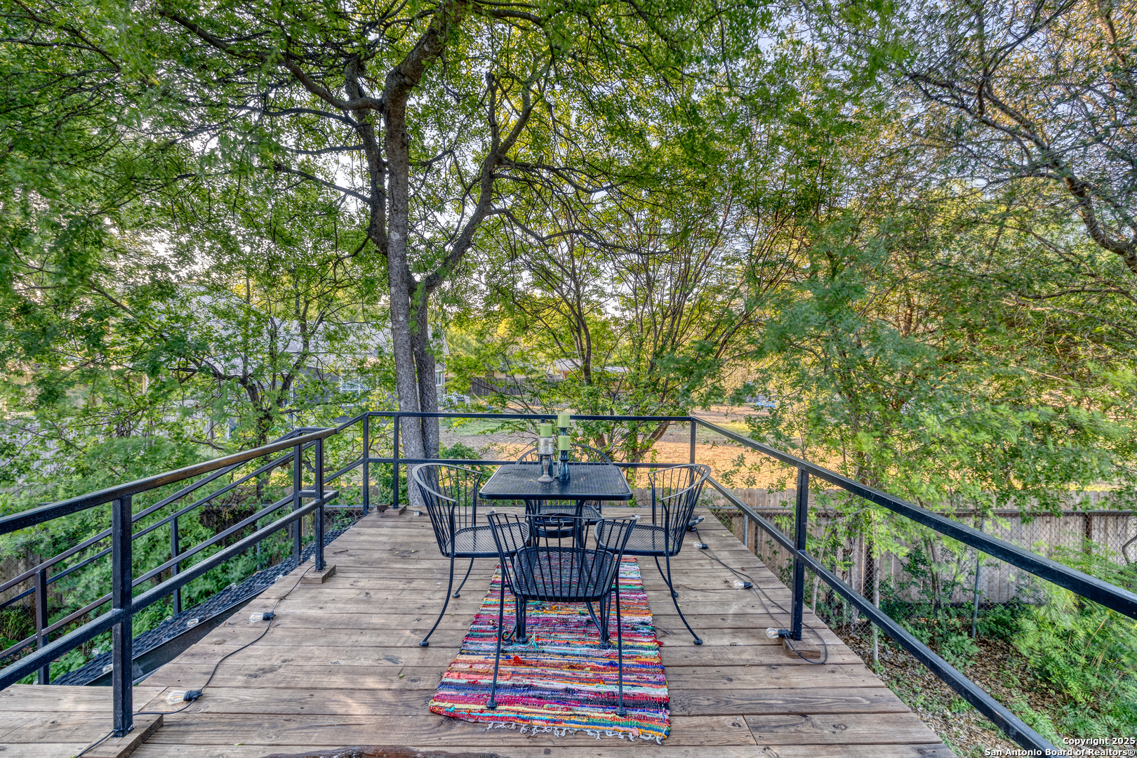 1100 North High Street Uvalde, TX 78801 - Photo 35 of 40 a view of a balcony with wooden floor and outdoor seating