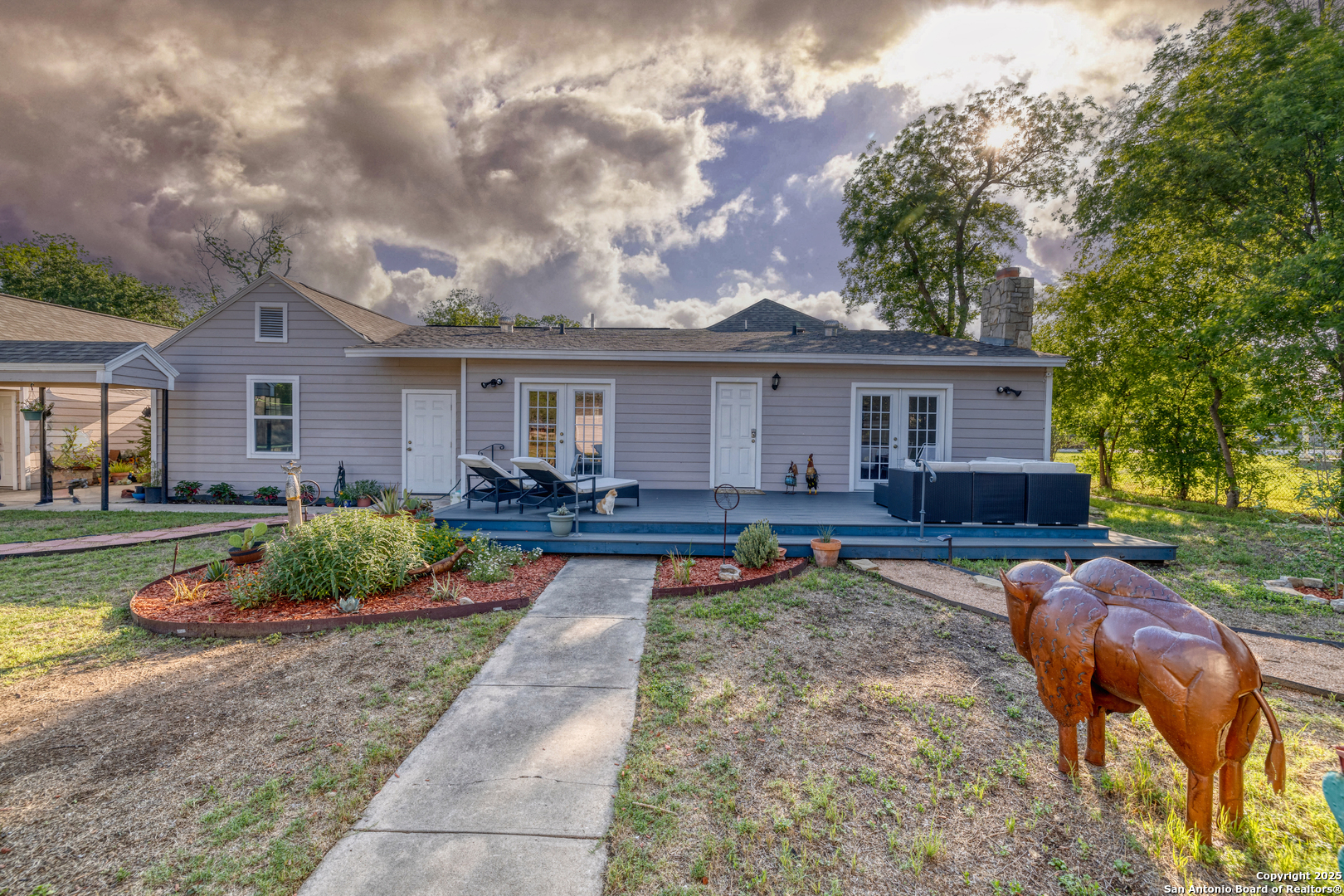 1100 North High Street Uvalde, TX 78801 - Photo 36 of 40 a front view of house with yard and outdoor seating