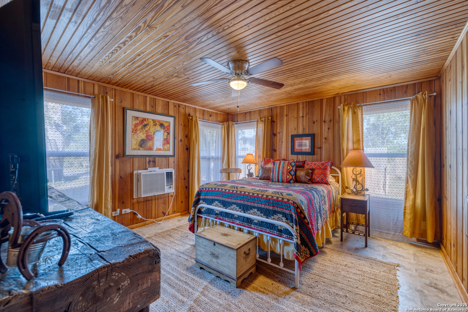 1100 North High Street Uvalde, TX 78801 - Photo 37 of 40 a bed sitting in a spacious bedroom next to a window