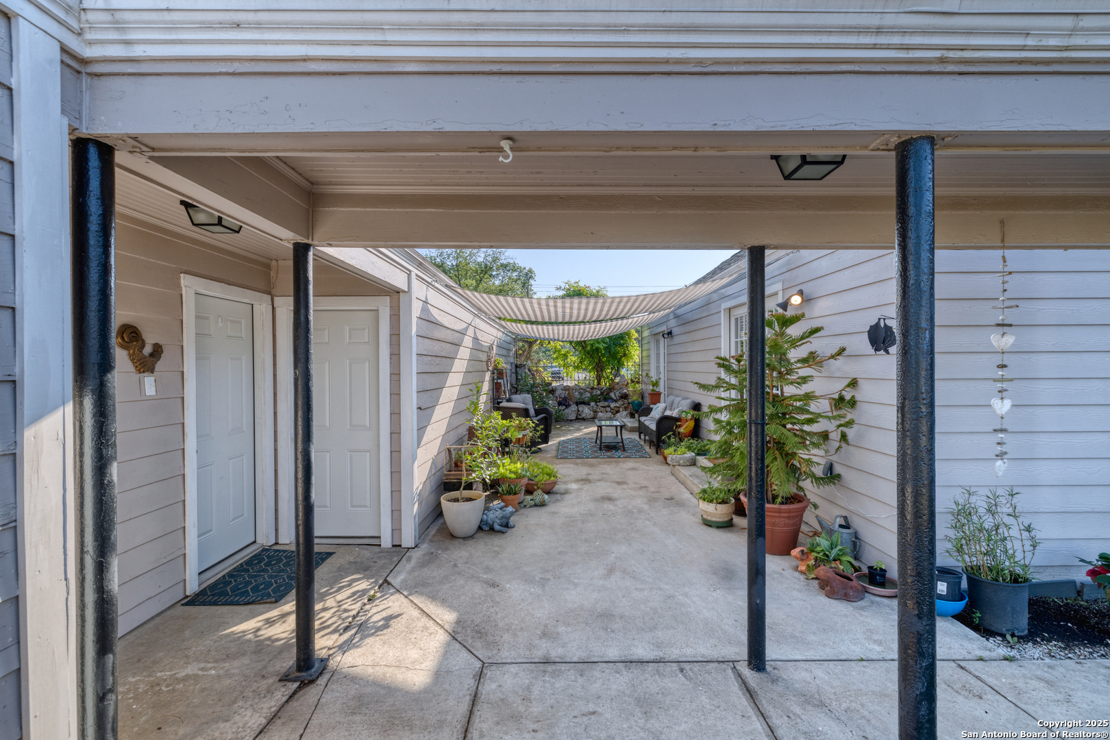 1100 North High Street Uvalde, TX 78801 - Photo 40 of 40 a view of a porch with chairs and potted plants