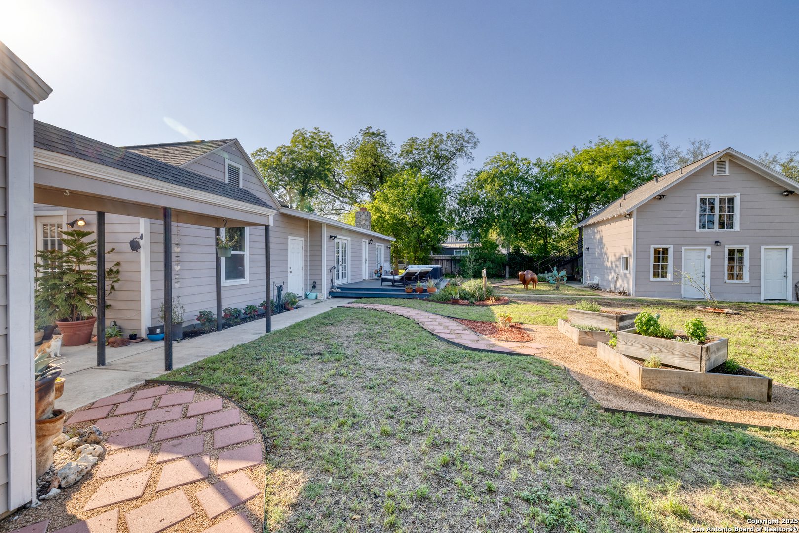 1100 North High Street Uvalde, TX 78801 - Photo 4 of 40 a view of backyard with swimming pool and outdoor seating