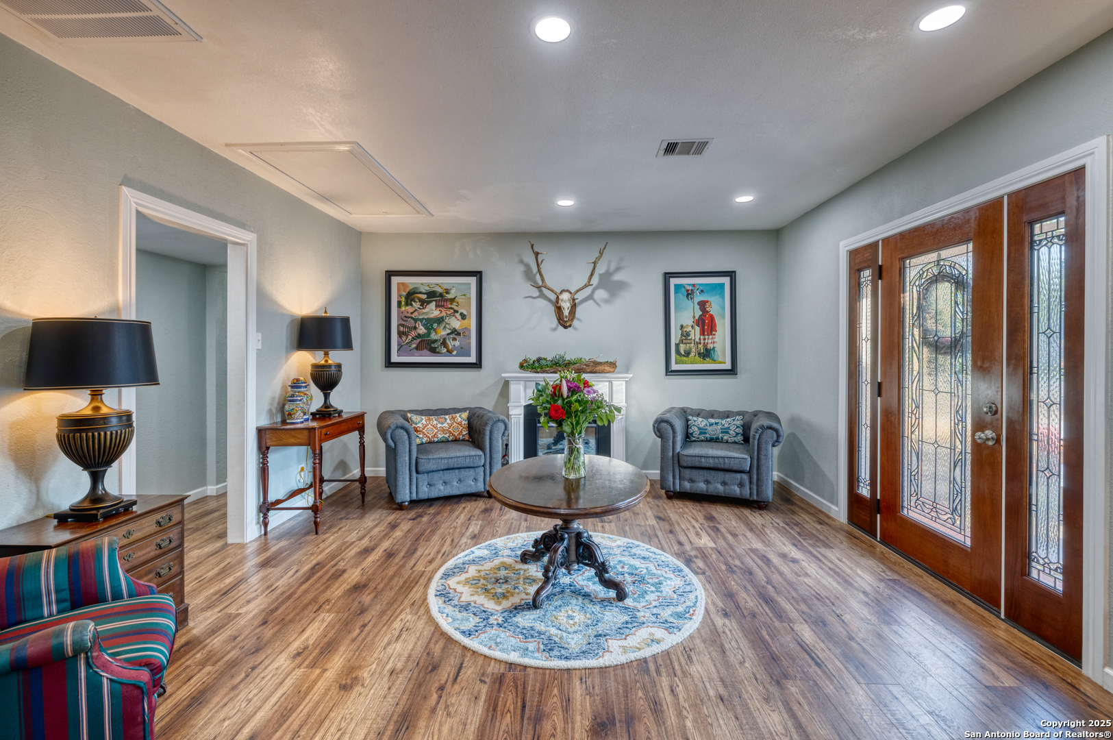 1100 North High Street Uvalde, TX 78801 - Photo 5 of 40 a living room with furniture and wooden floor