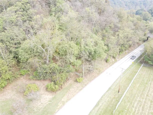 a sign board with a small yard