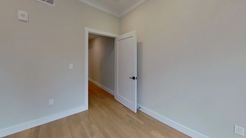 104-106 Warren Street, Unit 1 Boston, MA 02135 - Photo 3 of 6 a view of an empty room