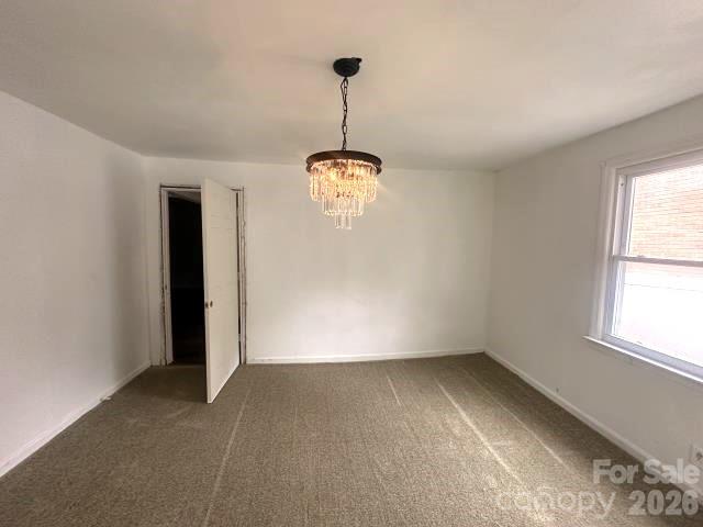 111 Dye Street Chester, SC 29706 - Photo 4 of 12 a view of a room with a window and wooden floor