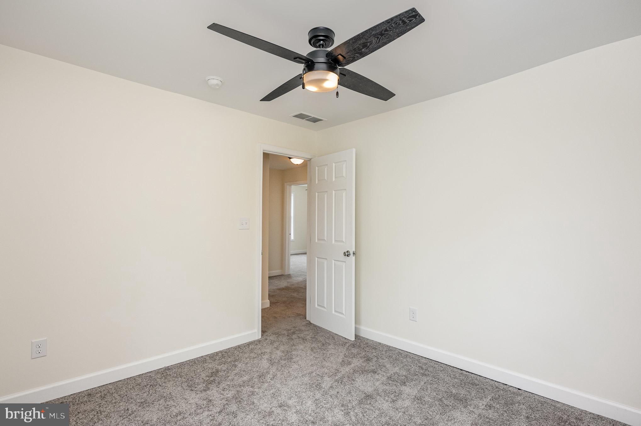 1591 Blue Ball Road Elkton, MD 21921 - Photo 17 of 30 an empty room with a ceiling fan and a window