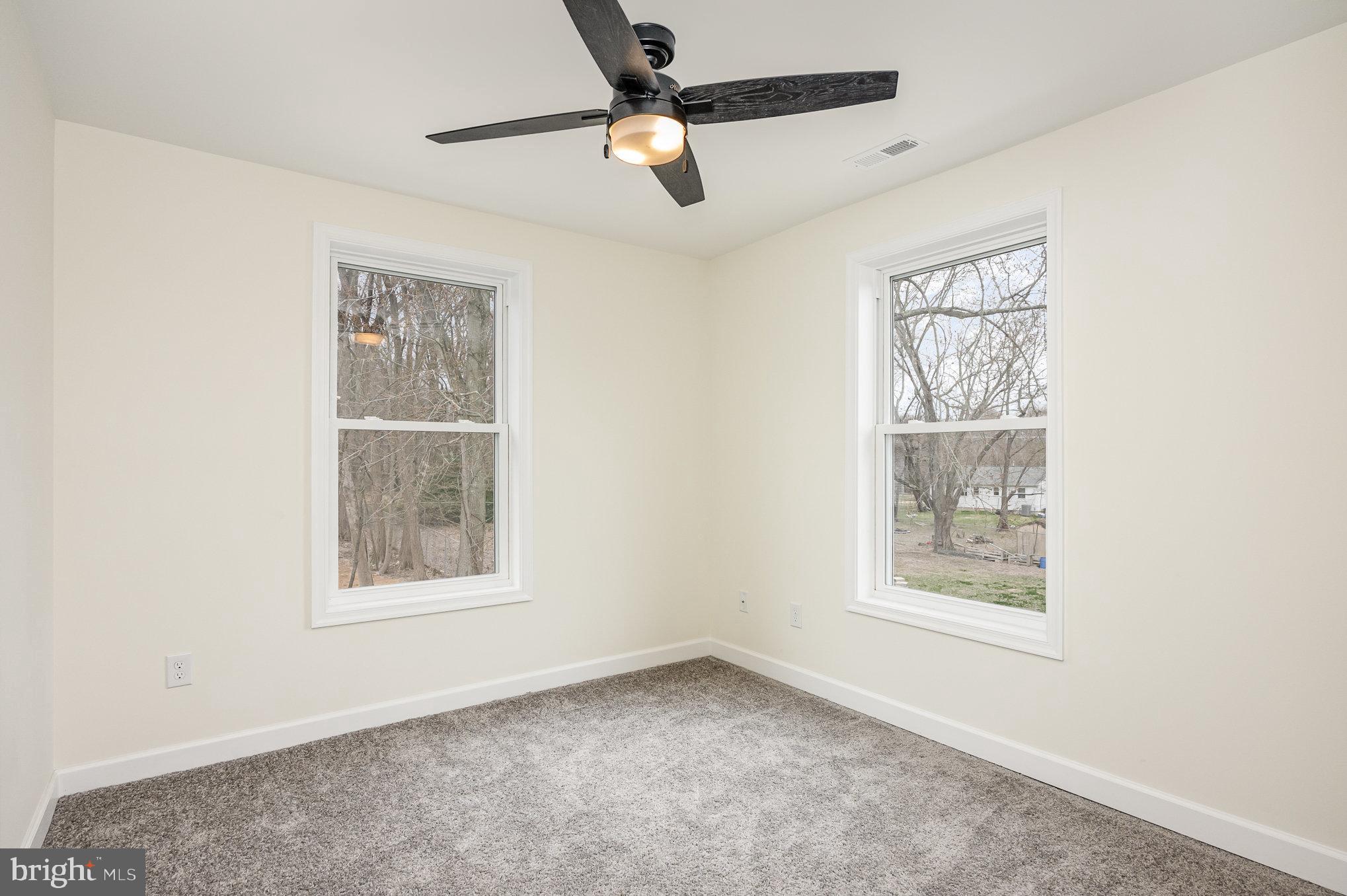 1591 Blue Ball Road Elkton, MD 21921 - Photo 19 of 30 an empty room with windows and fan