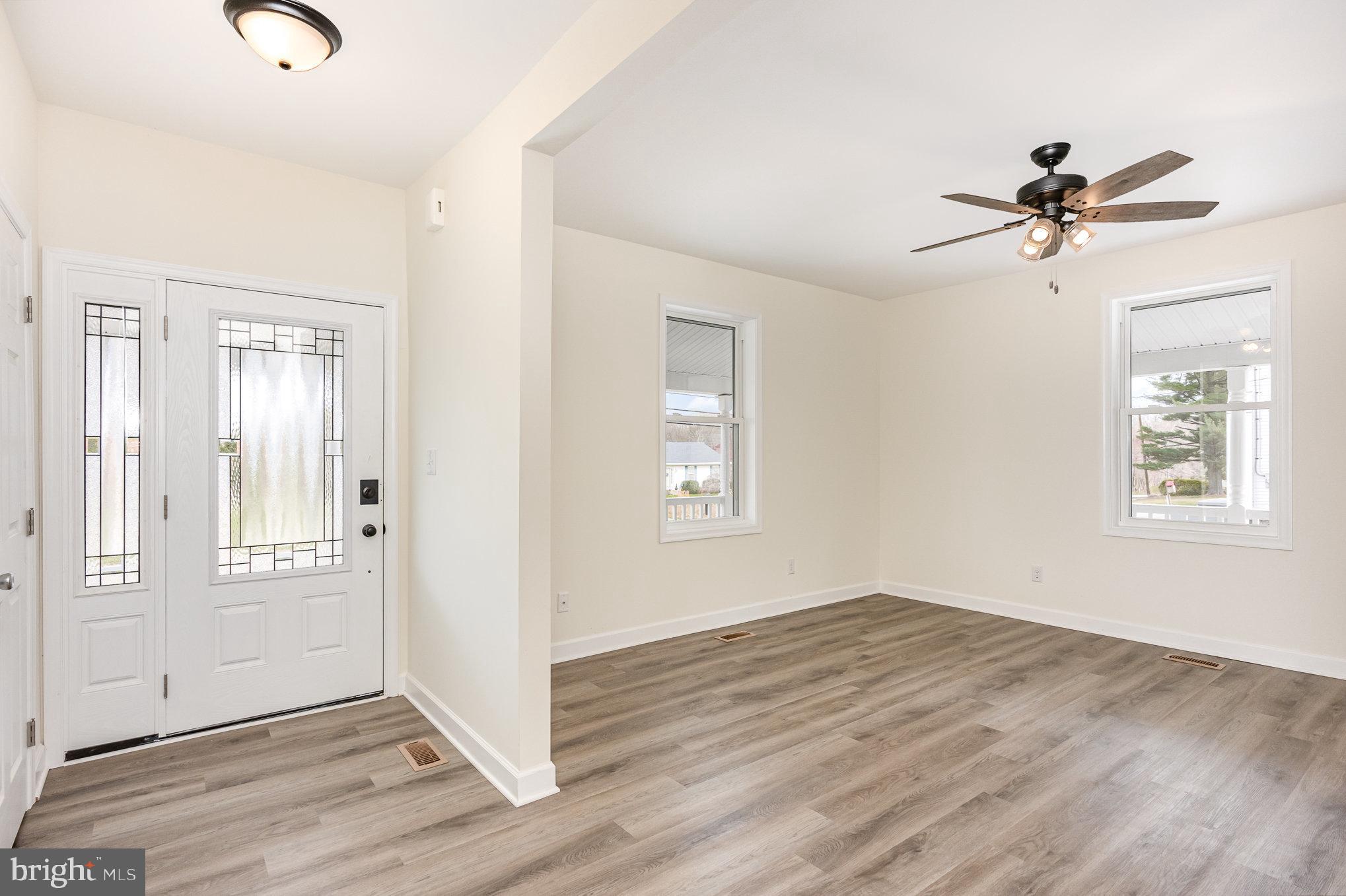 1591 Blue Ball Road Elkton, MD 21921 - Photo 4 of 30 a view of empty room with wooden floor and fan